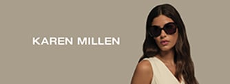 A pair of pink Kylie Minogue eyeglasses with clear lenses, shown from the front.