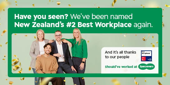 Five professionally dressed people pose in front of a green background next to a Best Workplaces New Zealand 2026 sign from Great Place to Work.
